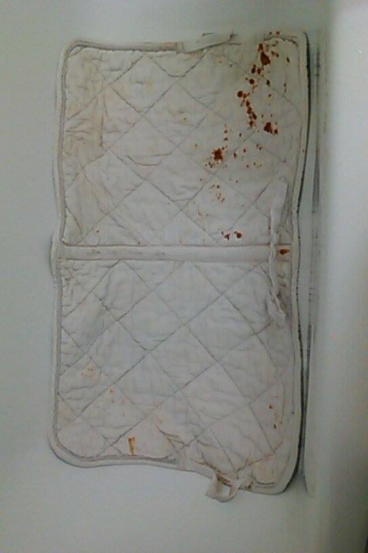 dessus du tapis (traces de rouille)